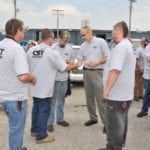CST staff talking in groups outside
