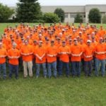 CST Team Picture outside in orange shirts