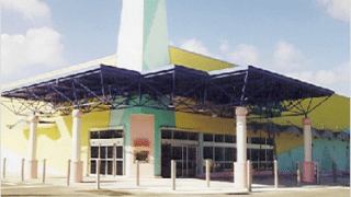 front of building with trusses over entrance