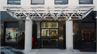 Front of building with covered entrance