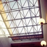 sun streaming in trussed windows