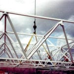 Trusses being lifted by crane