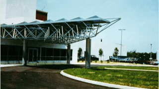 Front of building with covered entrance