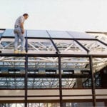 Construction worker assembling frame