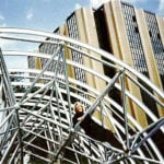 person sitting in high truss structure