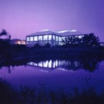 night view of building with walls of windows
