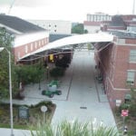 truss covered walkway between buildings
