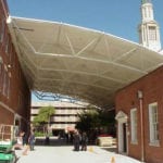 truss covered walkway between buildings