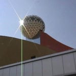Metal Ball on Golden Moon Building Gleaming in Sun