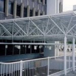 intricate truss system in front of building
