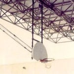 Close up of trusses with basketball net hanging