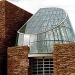 Glass structure part of building